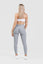 Blonde girl wearing adapt scrunch bum leggings in grey, back