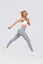 Girl leaping in air wearing grey adapt scrunch bum leggings