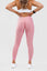 Girl posing hands on hips wearing pink adapt scrunch bum leggings from behind