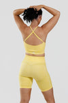 Close up girl wearing yellow calypso seamless short