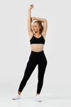 Girl wearing black intrigue scrunch bum leggings front