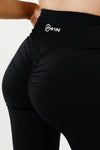 Girl wearing black intrigue scrunch bum leggings front