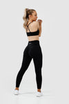 Girl wearing black intrigue scrunch bum leggings front