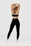 Girl wearing black intrigue scrunch bum leggings front