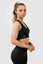 Girl wearing invictus seamless crop in black, side