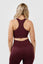 Girl wearing invictus seamless set plum purple back