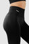 Close up side view girl wearing invictus seamless leggings in black