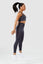 Girl jumping wearing charcoal invictus seamless set