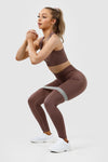 Girl wearing invictus seamless leggings mauve purple front
