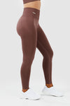 Girl wearing invictus seamless leggings mauve purple front