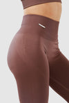 Girl wearing invictus seamless leggings mauve purple front