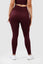 girl wearing invictus seamless leggings in plum purple back