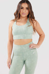 girl wearing legacy sports bra in mint