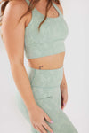 girl wearing legacy sports bra in mint