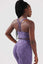 Girl wearing legacy scrunch bum purple set back