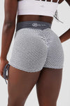 Close up girl wearing grey luna scrunch bum short hand on hip front