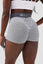 Close up girl wearing grey luna scrunch bum shorts back