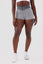 Girl wearing grey luna scrunch bum shorts front