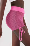 Close up girl wearing pink luna scrunch bum shorts front