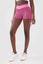 girl wearing pink luna scrunch bum shorts front