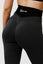 Close up girl wearing black luna scrunch bum leggings back