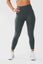 Close up girl wearing khaki luna x seamless scrunch bum leggings hand on hip front
