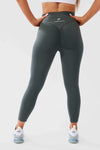 Close up girl wearing khaki luna x seamless scrunch bum leggings hand on hip front