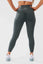 Close up girl posing hands on hips wearing khaki luna x seamless scrunch bum leggings back