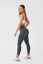 Girl posing hand on hip wearing khaki luna x seamless scrunch bum leggings side