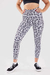 Close up girl hands in pockets wearing leopard luxe scrunch bum pocket leggings side
