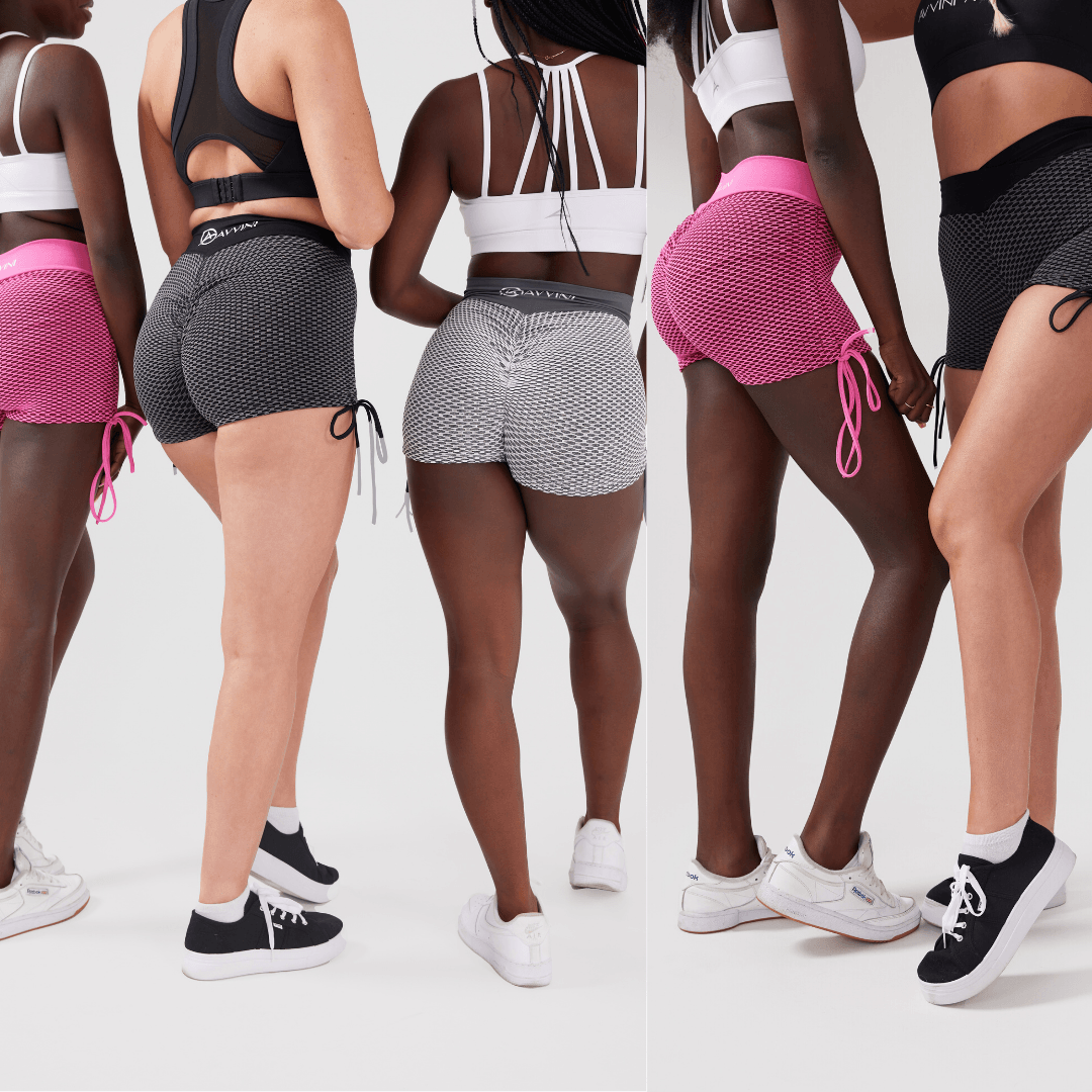 Group shot of girls form behind wearing luna scrunch bum shorts in pink, black and grey