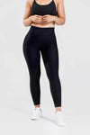 Girl posing wearing adapt scrunch bum leggings in black, front shot