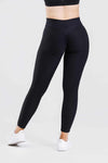 Girl posing wearing adapt scrunch bum leggings in black, front shot