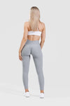 Girl wearing grey adapt scrunch bum leggings
