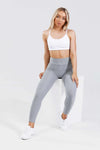 Girl wearing grey adapt scrunch bum leggings