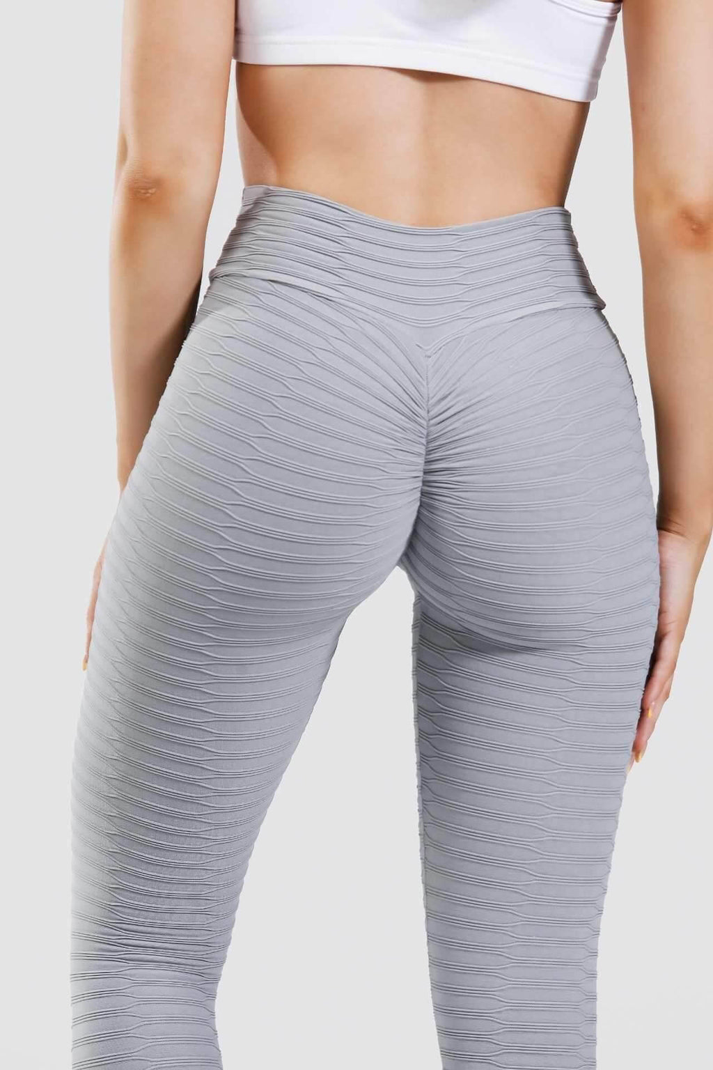 Close up adapt scrunch bum leggings in grey from behind