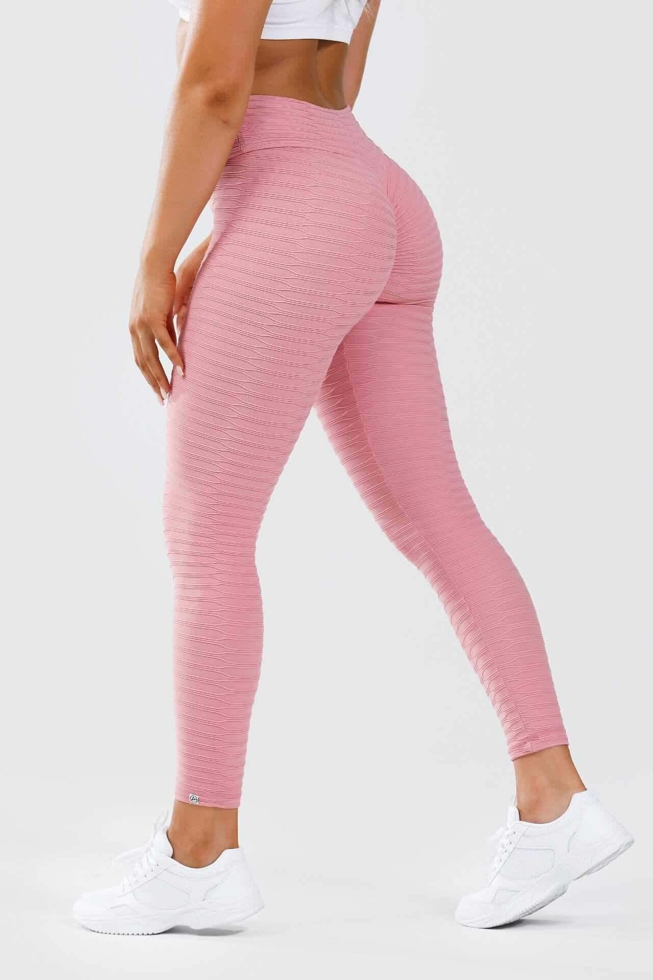 Side view of girl wearing pink adapt scrunch bum leggings