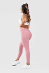 Girl wearing pink adapt scrunch bum leggings