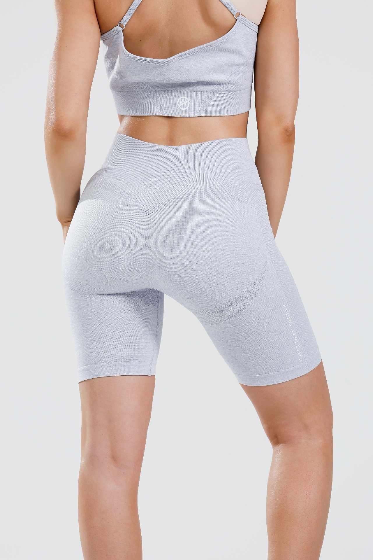 Close up shot of girl wearing calypso seamless set in blue marl from behind