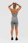 Close up front shot of girl wearing calyspo seamless shorts in grey 