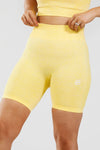 Close up girl wearing yellow calypso seamless short