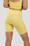 Close up girl wearing yellow calypso seamless short