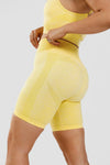 Close up girl wearing yellow calypso seamless short