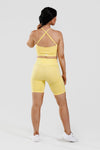 Close up girl wearing yellow calypso seamless short