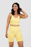Girl wearing calypso seamless set yellow front 