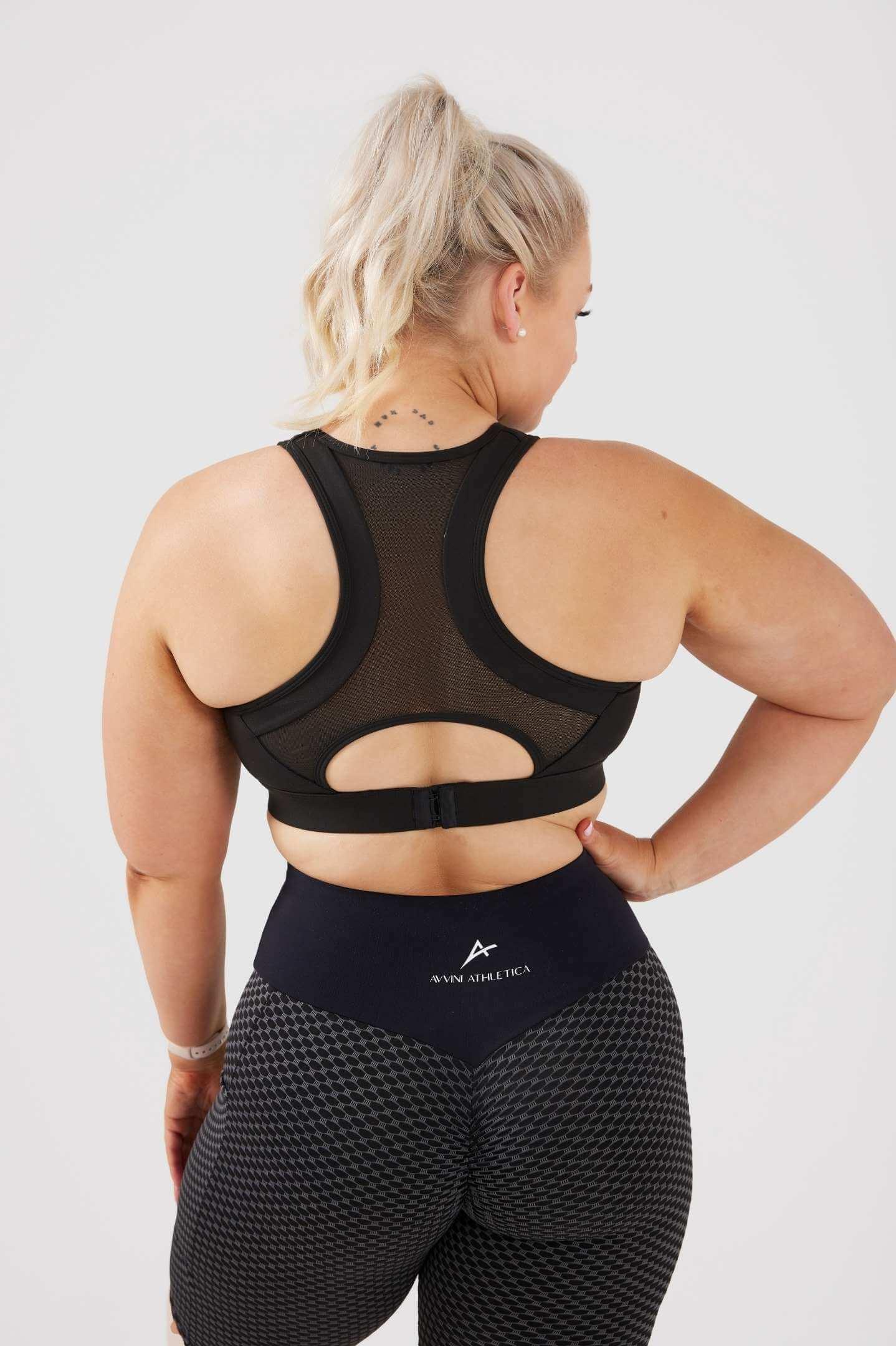 Girl wearing black classic crop top, back