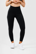Girl wearing black intrigue scrunch bum leggings front