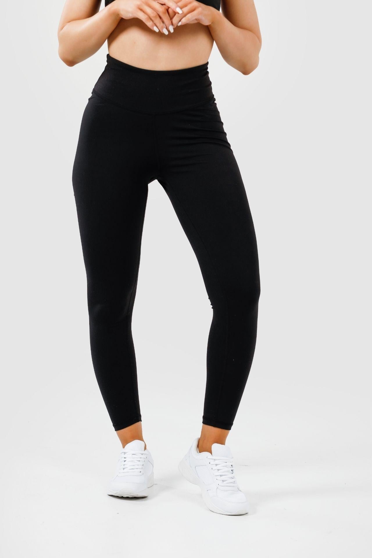 Girl wearing black intrigue scrunch bum leggings front