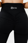 Girl wearing black intrigue scrunch bum leggings front