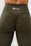 Girl wearing olive intrigue scrunch bum leggings hands on hips